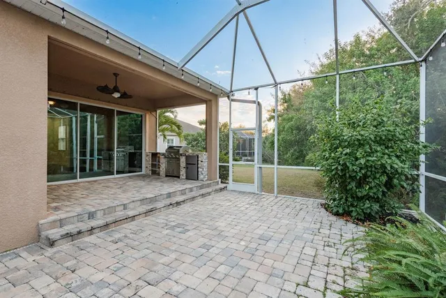 a view of a table and chairs under an umbrella