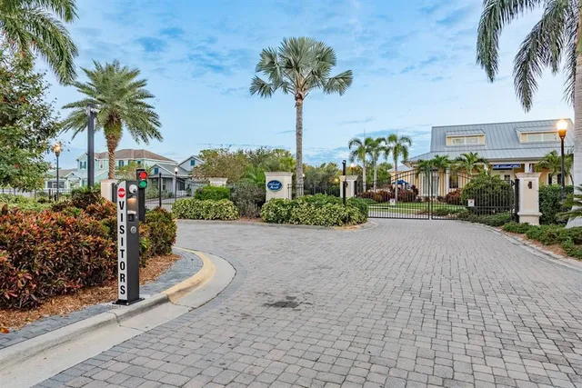 a front view of a house with plants
