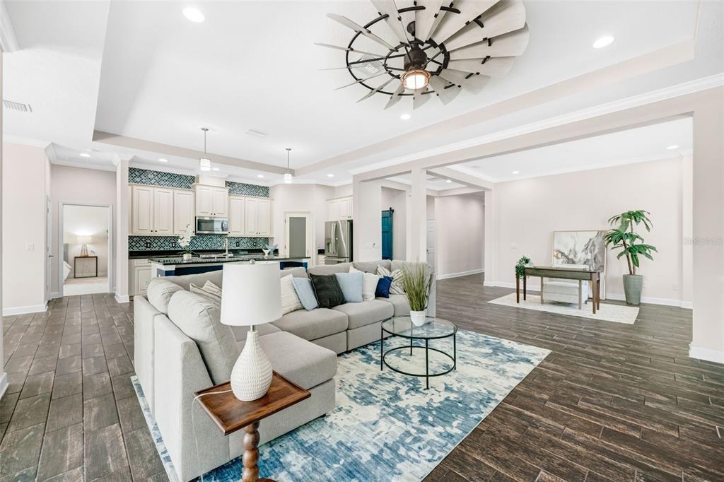 5116 Coastal Scene Drive Apollo Beach, FL 33572 - Photo 5 of 36 a living room with furniture and kitchen view