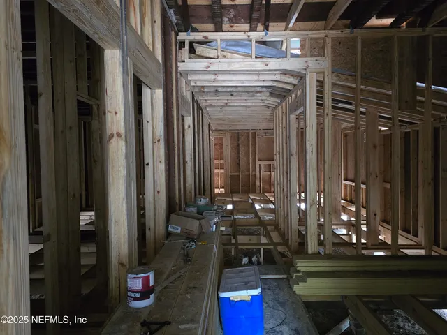 a room with lots of stuff and wood floor