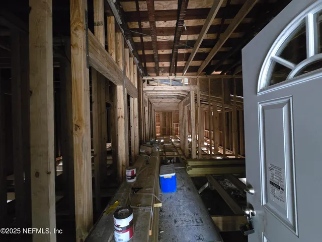 a view of a room with door and stairs