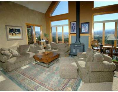 318 Strohm Circle Gypsum, CO 81637 - Photo 2 of 6 a living room with furniture and a large window
