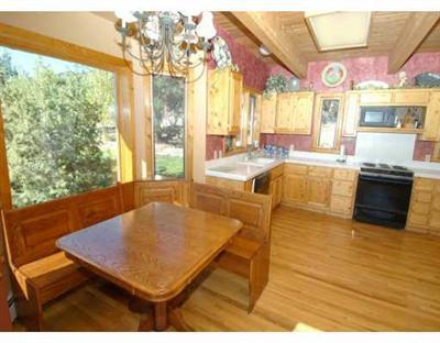 318 Strohm Circle Gypsum, CO 81637 - Photo 3 of 6 a living room with furniture pool table and large windows