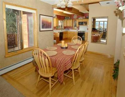 318 Strohm Circle Gypsum, CO 81637 - Photo 4 of 6 a dining room with furniture and wooden floor