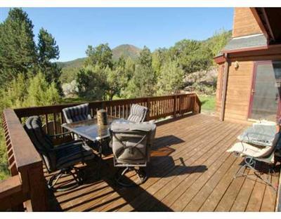 318 Strohm Circle Gypsum, CO 81637 - Photo 5 of 6 a view of a balcony with two chairs and a table