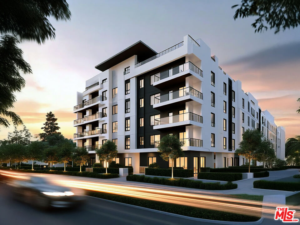 12335 Osborne Place Pacoima, CA 91331 - Photo 1 of 2 a front view of a building with street view and trees