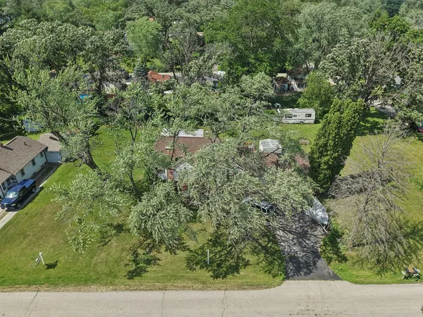 an aerial view of a houses with outdoor space