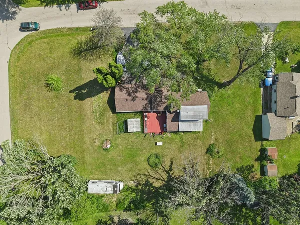 a view of yard with swimming pool and green space