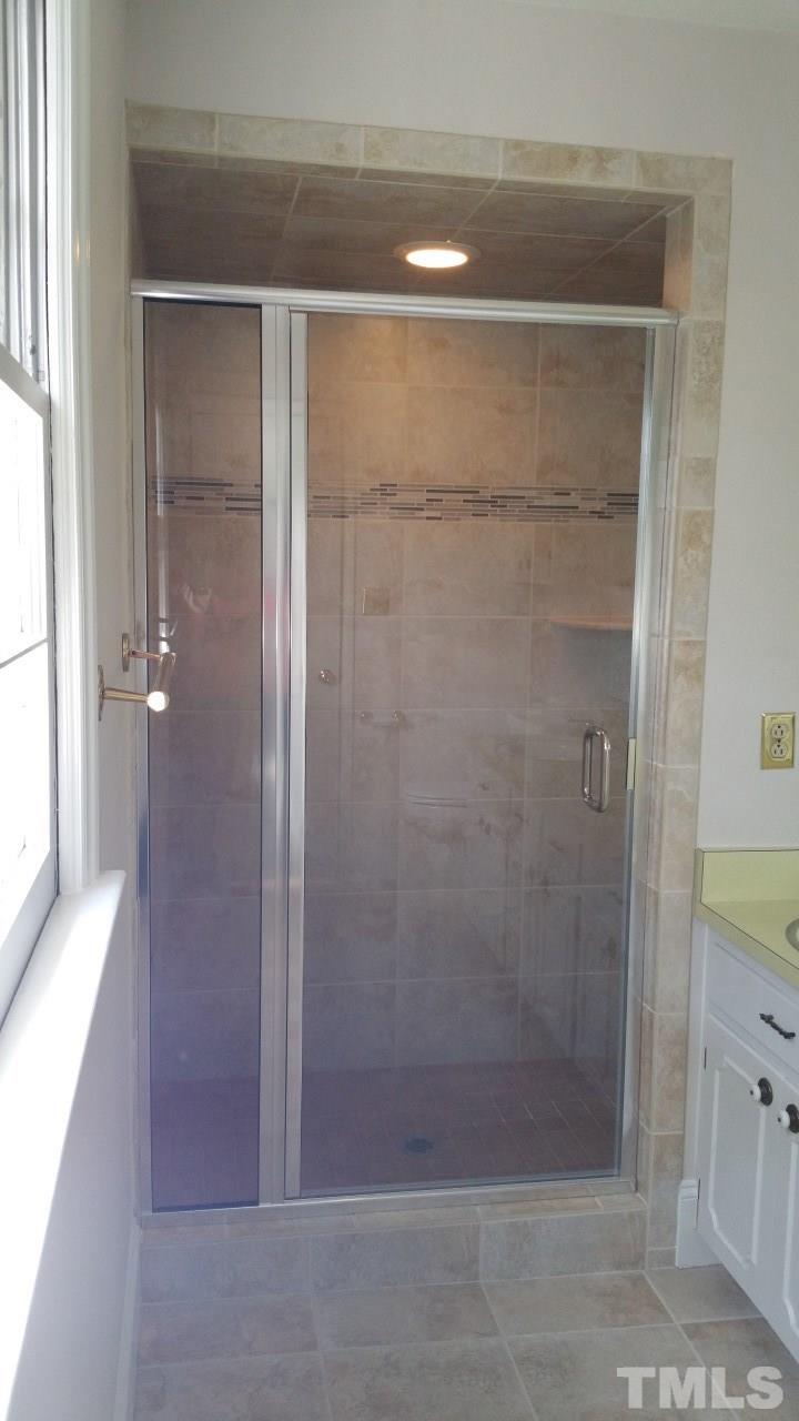 3805 Oak Park Road Raleigh, NC 27612 - Photo 14 of 20 a bathroom with a shower