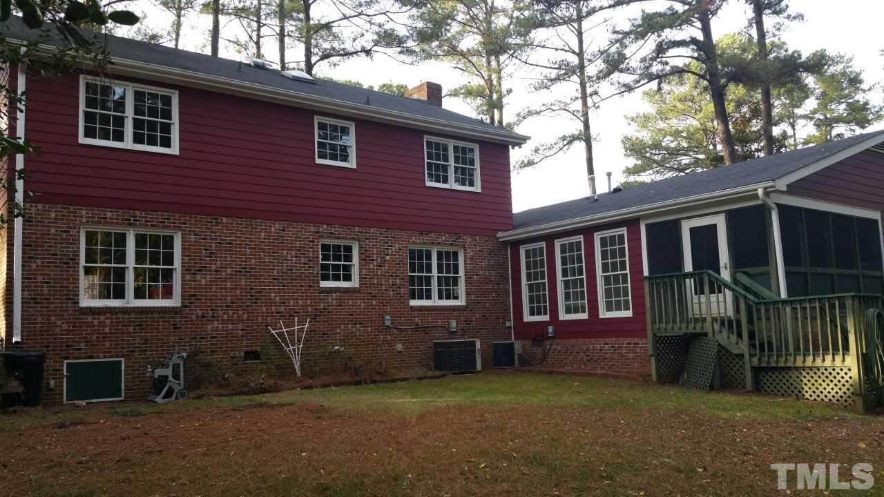 3805 Oak Park Road Raleigh, NC 27612 - Photo 18 of 20 a view of a house with a yard and a large tree