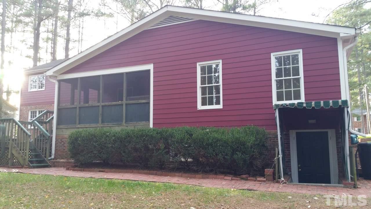 3805 Oak Park Road Raleigh, NC 27612 - Photo 20 of 20 a front view of a house with garden