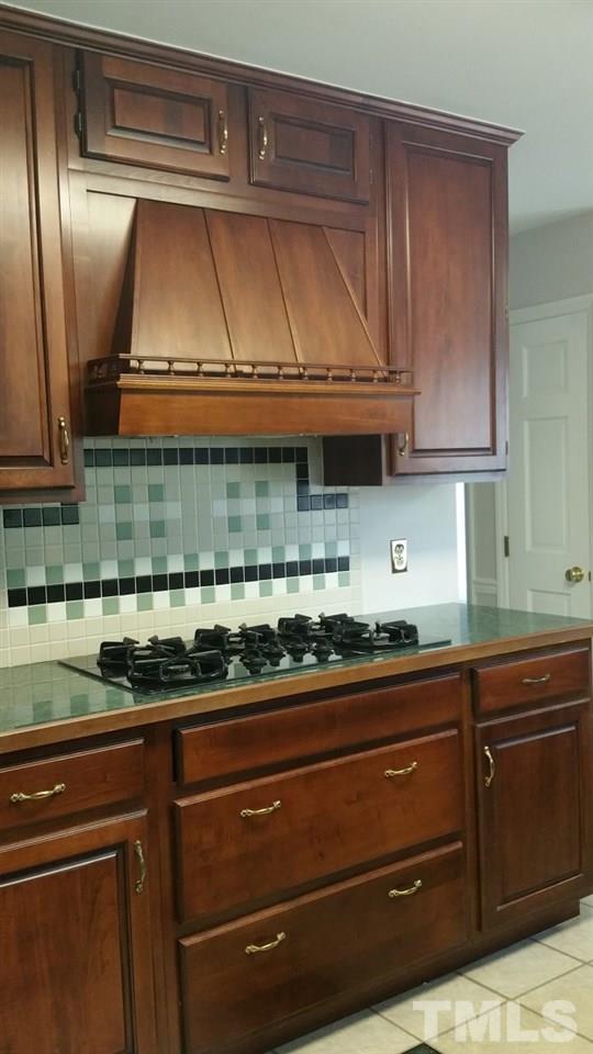 3805 Oak Park Road Raleigh, NC 27612 - Photo 5 of 20 a kitchen with a sink and cabinets