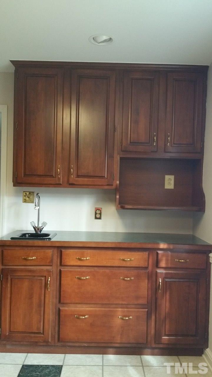 3805 Oak Park Road Raleigh, NC 27612 - Photo 6 of 20 a kitchen with granite countertop cabinets and window