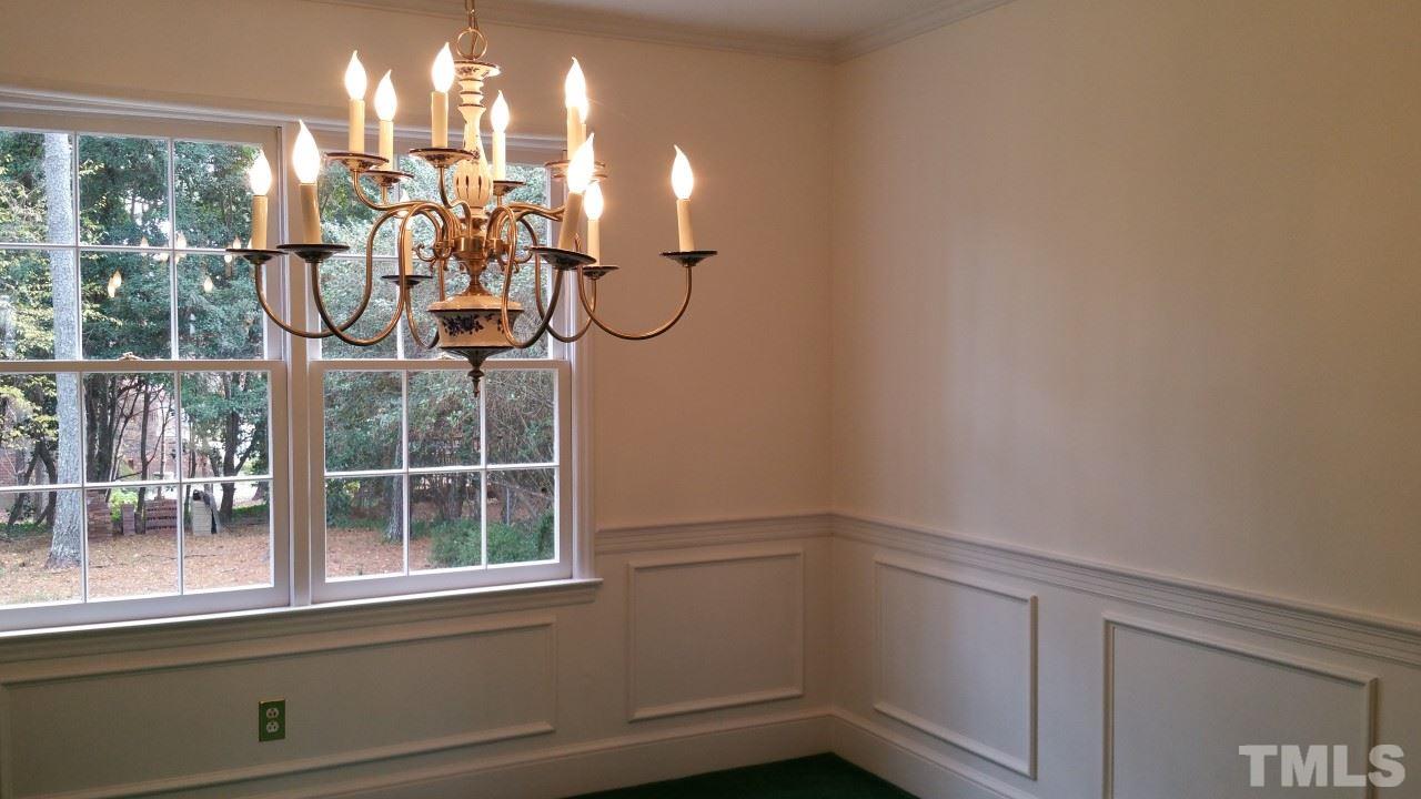 3805 Oak Park Road Raleigh, NC 27612 - Photo 7 of 20 a view of a room with rack on the wall and a window
