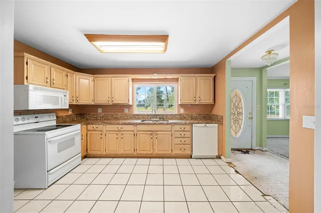 a view of a bathroom with a glass door shower and a sink