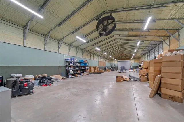 a kitchen with a refrigerator and a stove top oven