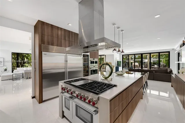 a kitchen with a stove and a refrigerator