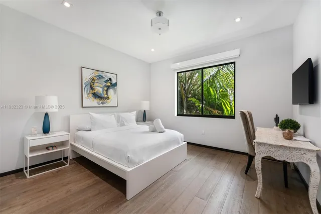 a bedroom with a bed and a desk