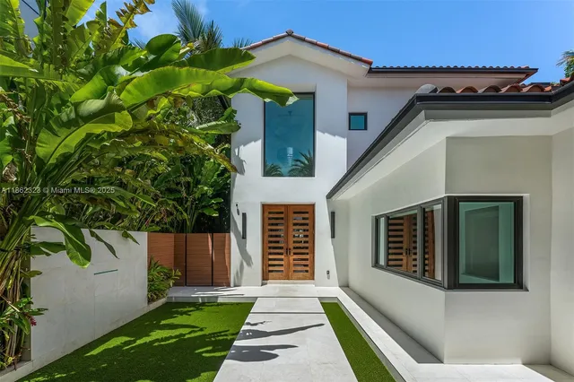 a front view of a house with a garage