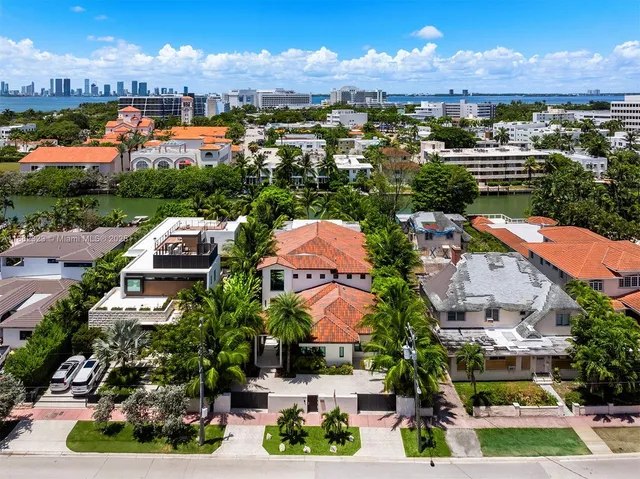 an aerial view of residential houses and outdoor space