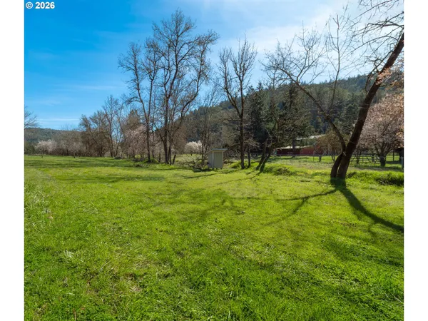 a view of a lake with a big yard