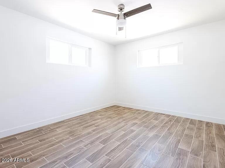 2915 West Griswold Road Phoenix, AZ 85051 - Photo 10 of 17 wooden floor in a empty room