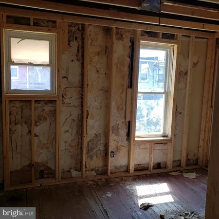 a view of a door with wooden floor