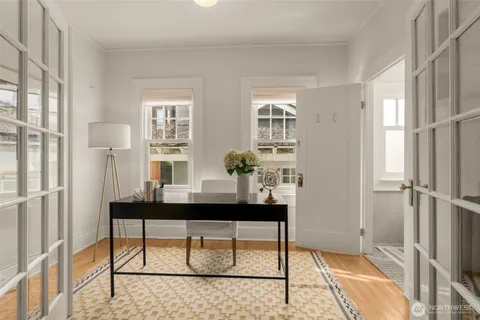 a view of a room with a table and chairs