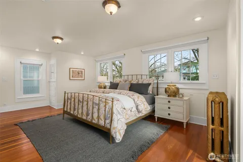 a bed room with a bed and a window