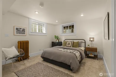 a bedroom with a bed and a chair