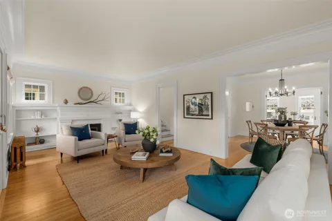 a living room with furniture potted plant and a fireplace