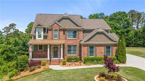a view of a hallway view with wooden floor and dining room