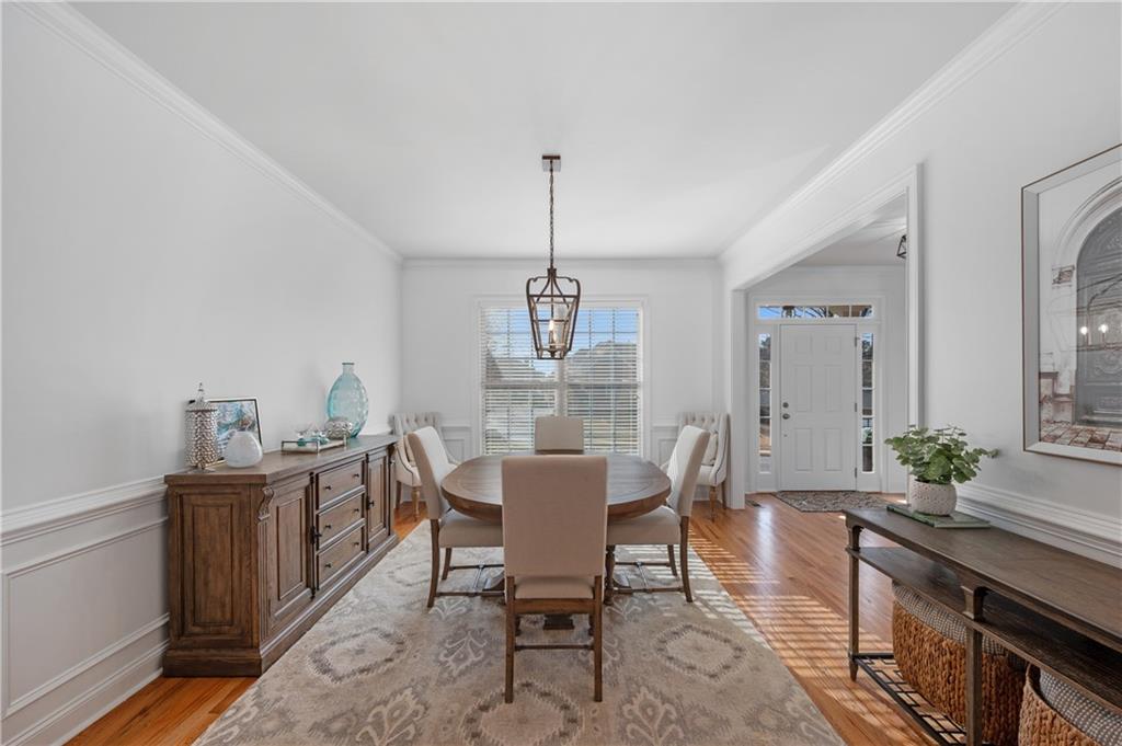 5740 Cascade Trail Cumming, GA 30040 - Photo 11 of 64 a view of a dining room with furniture window and wooden floor
