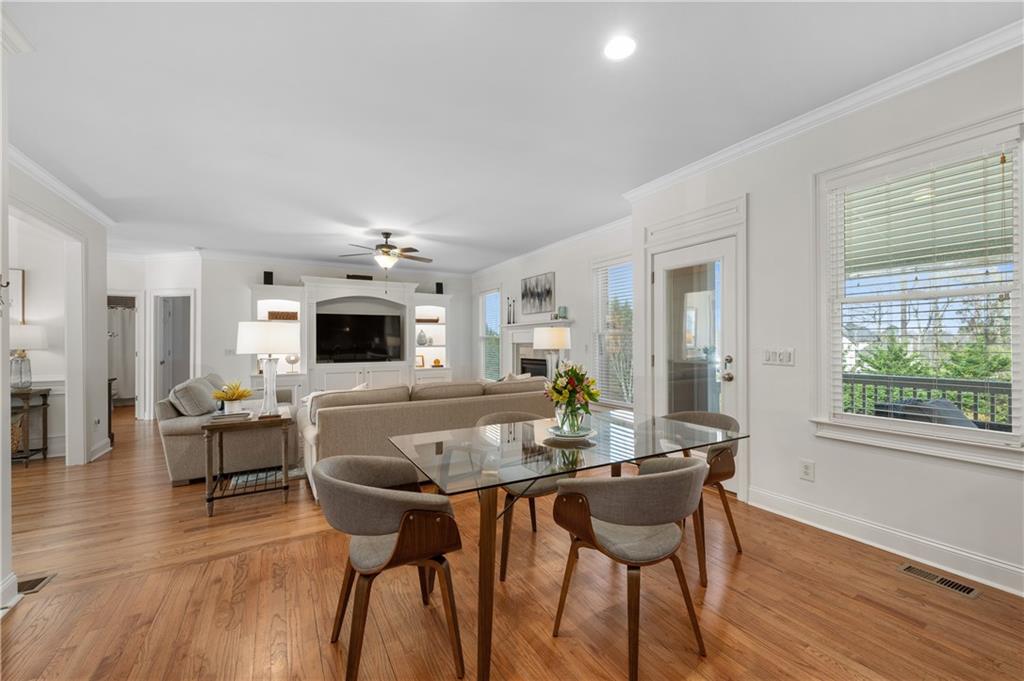 5740 Cascade Trail Cumming, GA 30040 - Photo 17 of 64 a view of a dining room with furniture window and wooden floor
