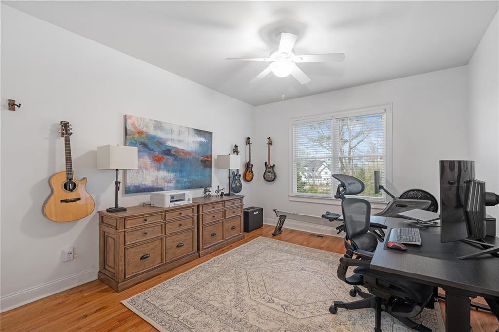 5740 Cascade Trail Cumming, GA 30040 - Photo 23 of 64 a view of a workspace with furniture and a window