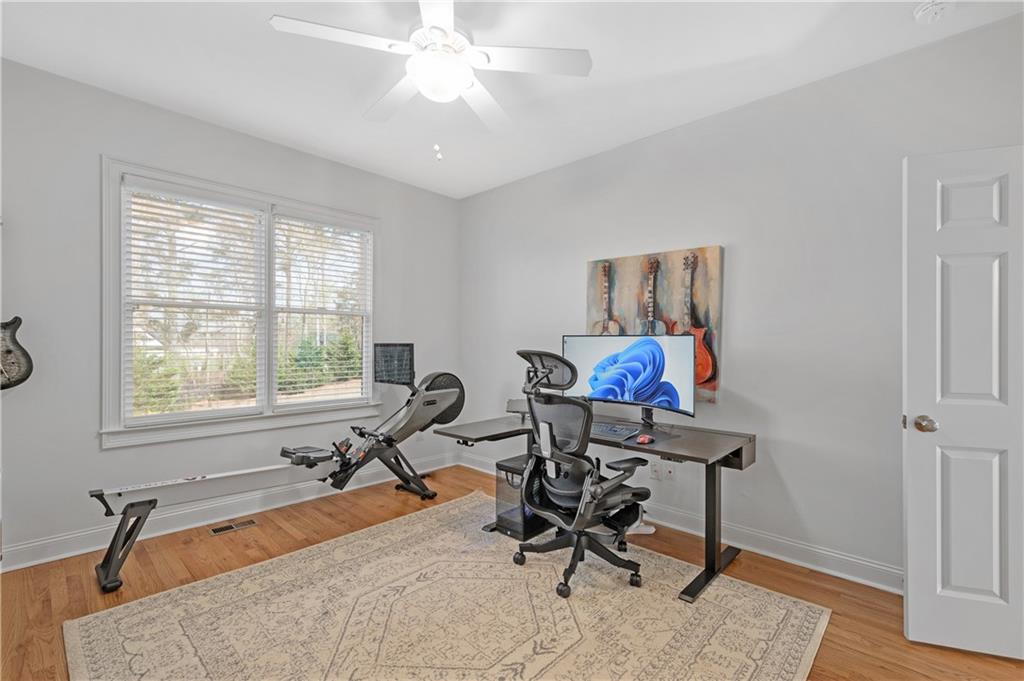 5740 Cascade Trail Cumming, GA 30040 - Photo 24 of 64 a view of a workspace with furniture and a window