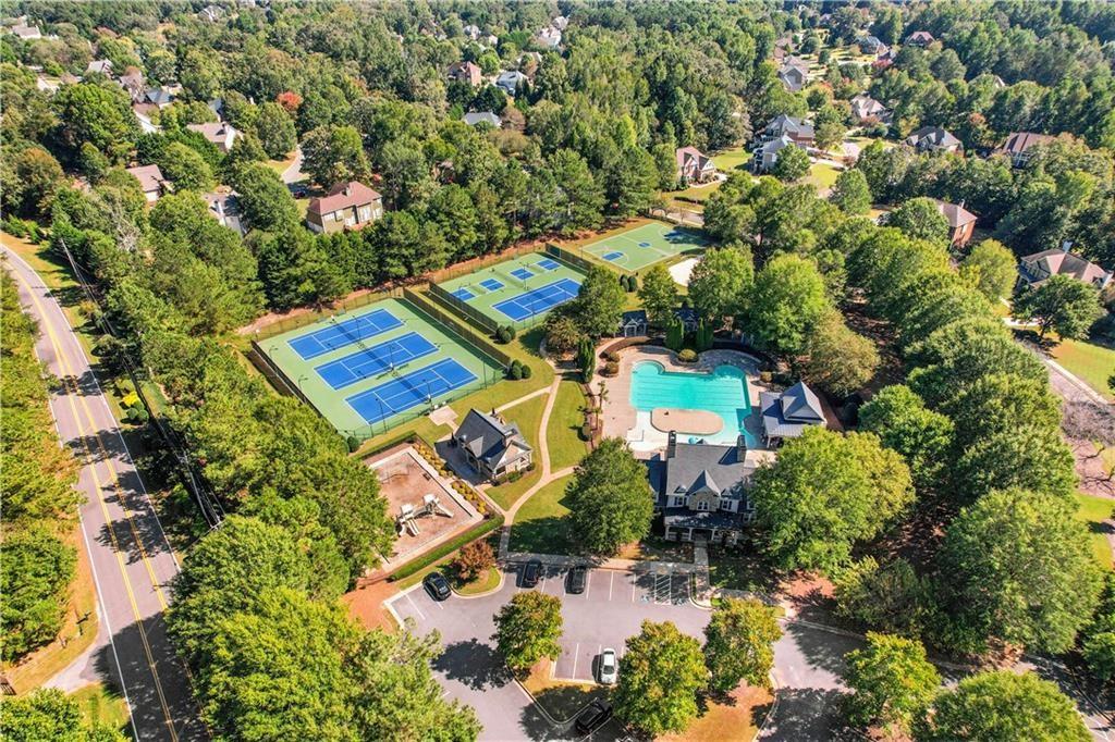 5740 Cascade Trail Cumming, GA 30040 - Photo 63 of 64 an aerial view of residential house with outdoor space and swimming pool