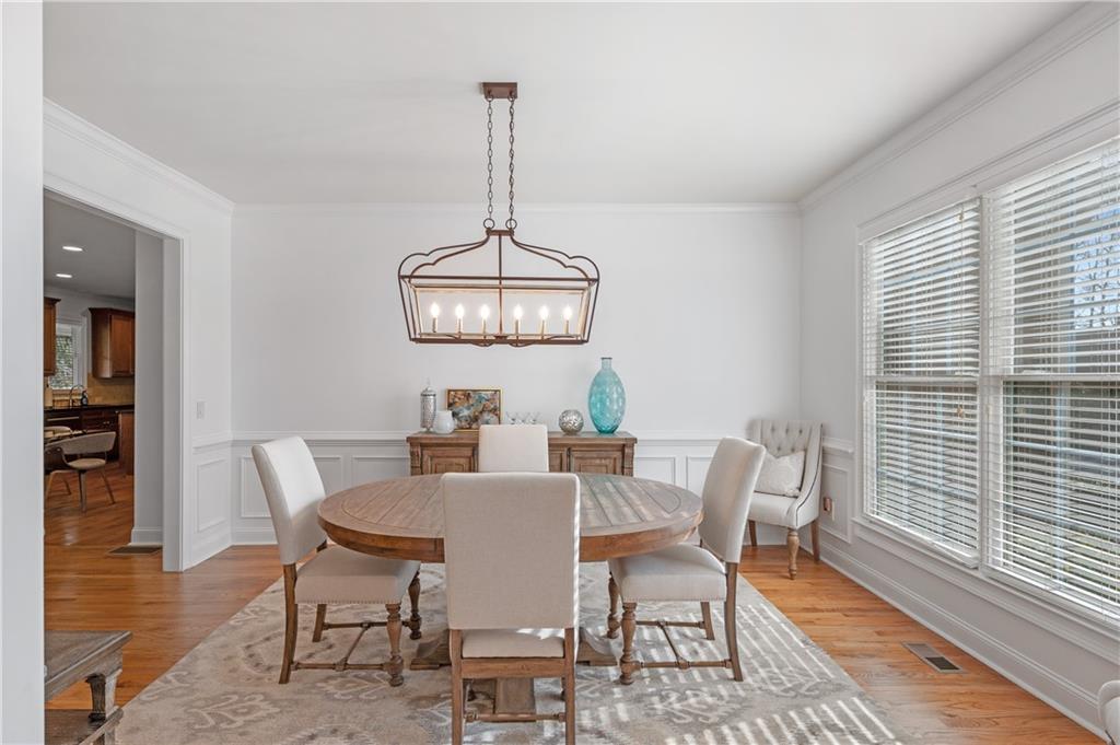 5740 Cascade Trail Cumming, GA 30040 - Photo 9 of 64 a view of a dining room with furniture window and wooden floor