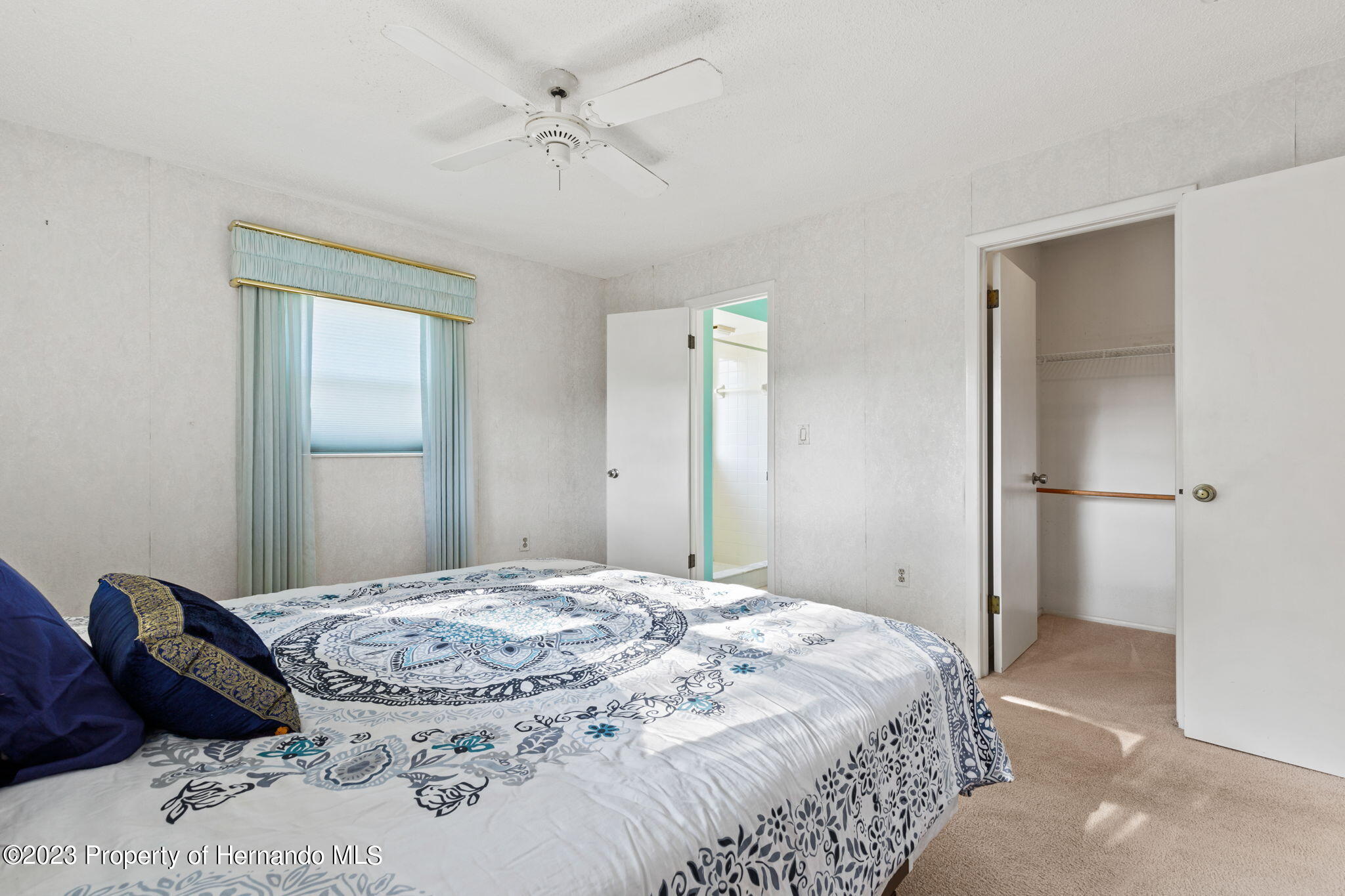 129 Candlewick Avenue Spring Hill, FL 34608 - Photo 14 of 28 master bedroom looking toward bath and c