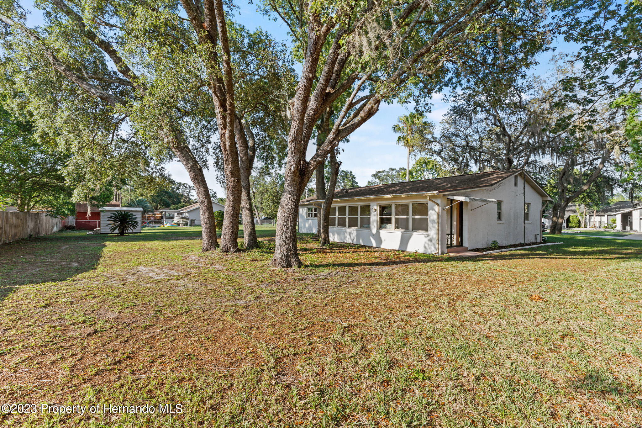 129 Candlewick Avenue Spring Hill, FL 34608 - Photo 26 of 28 34 back yard side view looking toward th