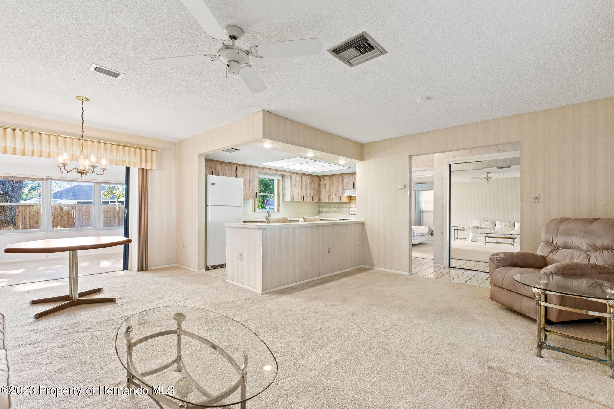 129 Candlewick Avenue Spring Hill, FL 34608 - Photo 6 of 28 9-living room looking toward kitchen 129