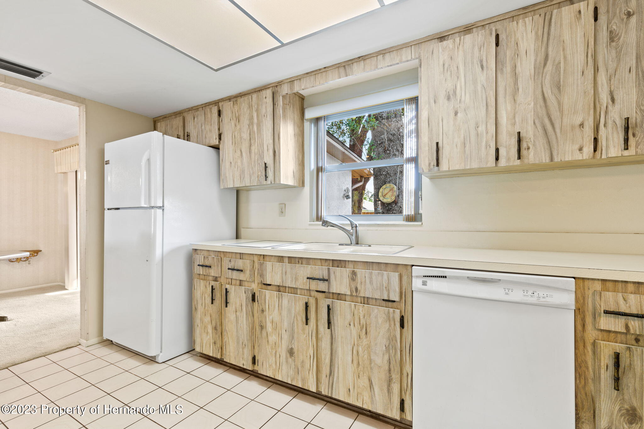 129 Candlewick Avenue Spring Hill, FL 34608 - Photo 9 of 28 13-kitchen with refrigerator 129 candlew