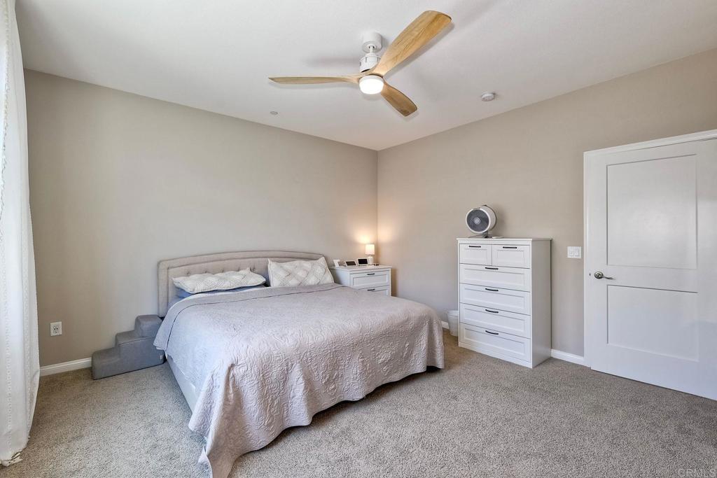 1715 Crabapple Way Oceanside, CA 92056 - Photo 11 of 31 a bedroom with a bed and a ceiling fan
