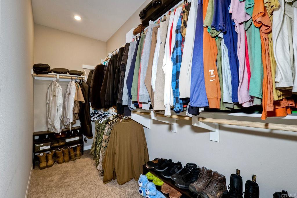 1715 Crabapple Way Oceanside, CA 92056 - Photo 14 of 31 a view of walk in closet with clothes and shoes