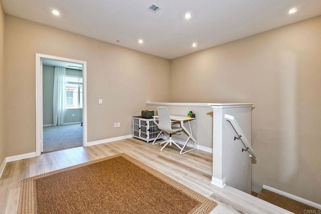 1715 Crabapple Way Oceanside, CA 92056 - Photo 15 of 31 wooden floor with a rug and a rug