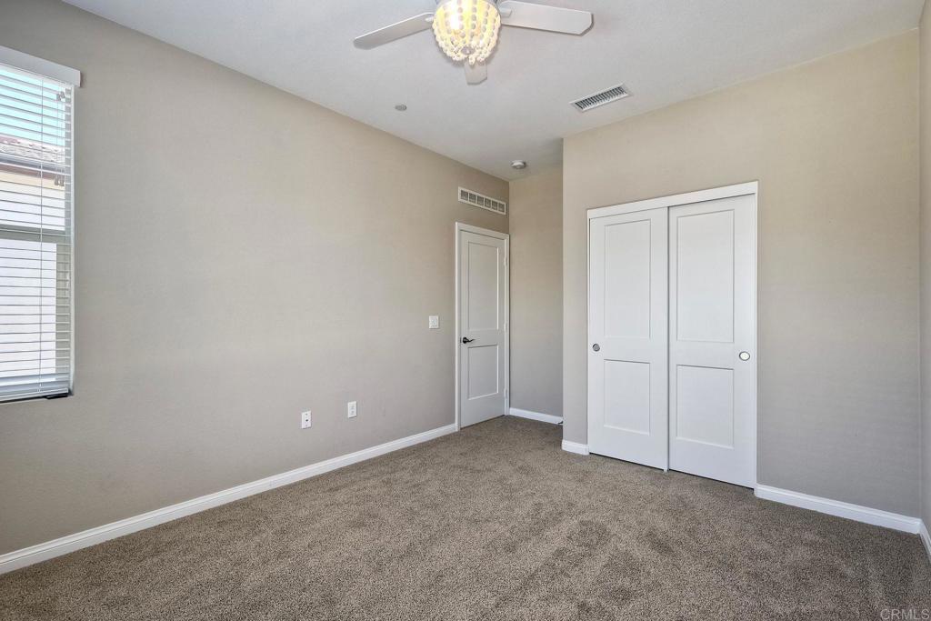 1715 Crabapple Way Oceanside, CA 92056 - Photo 20 of 31 a view of an empty room and a window