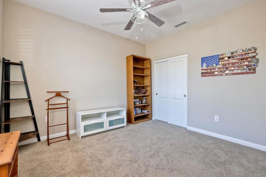 1715 Crabapple Way Oceanside, CA 92056 - Photo 21 of 31 a view of an empty room with a window