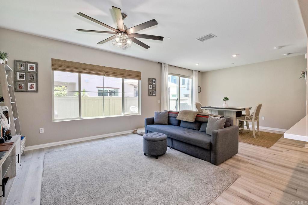 1715 Crabapple Way Oceanside, CA 92056 - Photo 6 of 31 a living room with furniture and a large window