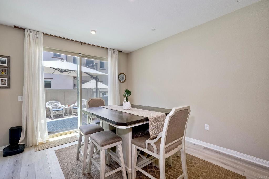 1715 Crabapple Way Oceanside, CA 92056 - Photo 7 of 31 a dining room with furniture and wooden floor