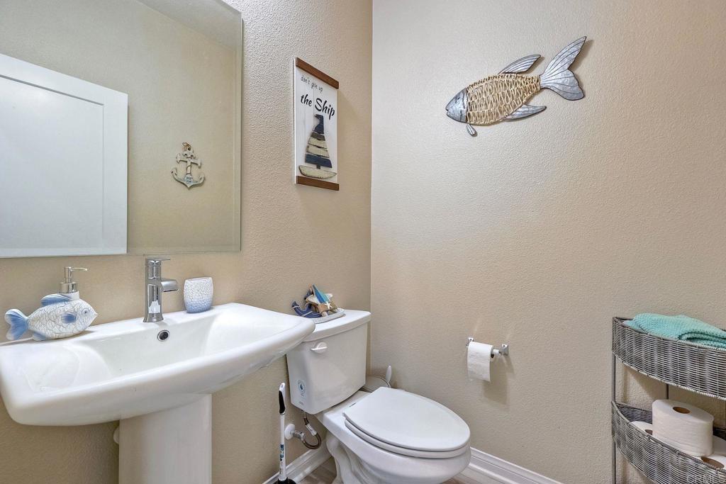 1715 Crabapple Way Oceanside, CA 92056 - Photo 10 of 31 a bathroom with a sink mirror and toilet